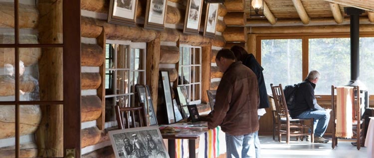 Guests viewing historic artifacts in Maligne Lake Chalet