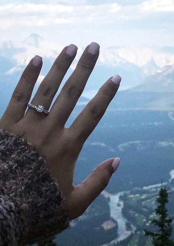 Engagement ring on the hand of Melissa Angarano overlooking the Bow Valley