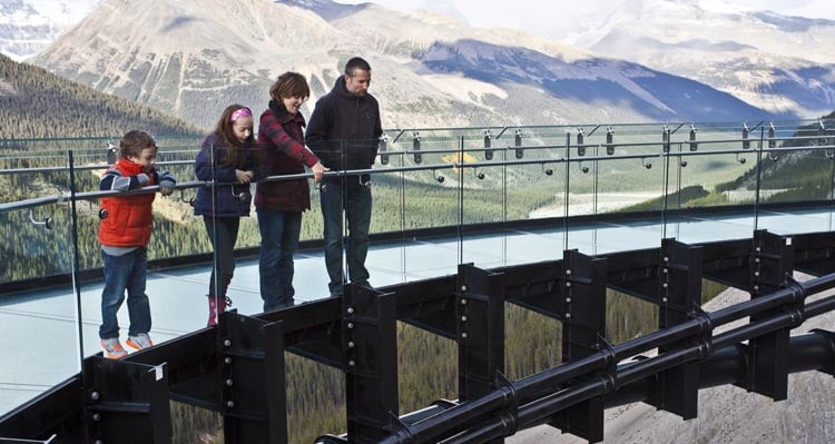A family looking down from the Columbia Icefield Skywalk