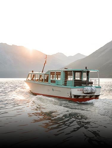 A boat cruises on a lake.