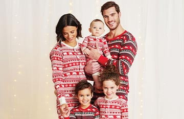 A family wearing red onesies.