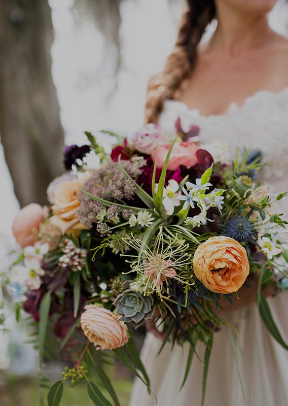 A bride holds a bouquet of flowers