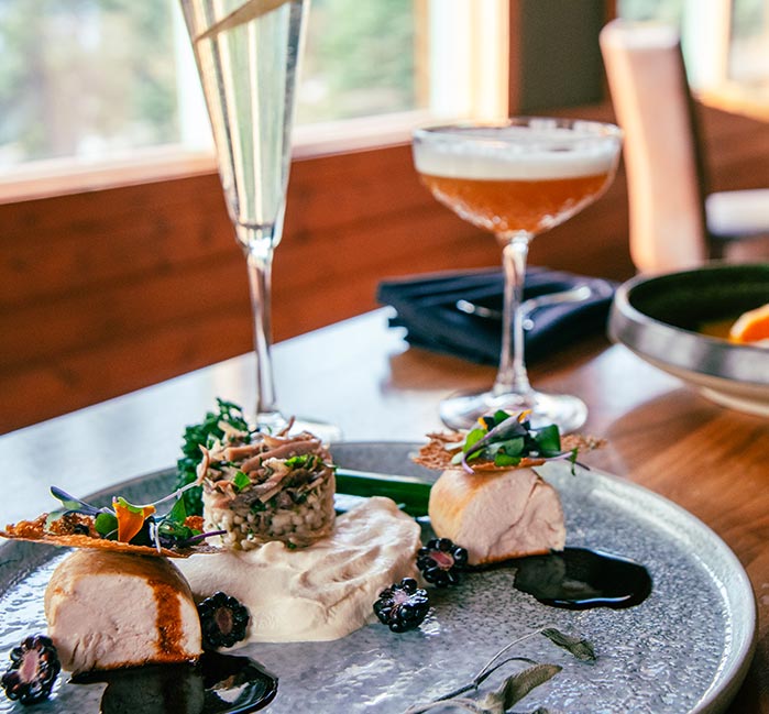 A dinner table with plates and drinks.