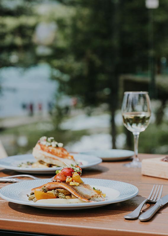 Two plates of food on a dining table.