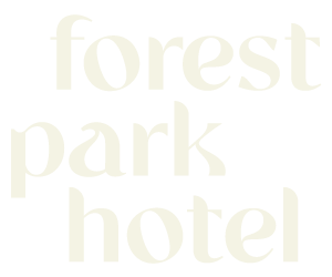 Forest Park Hotel exterior in a mountain landscape.