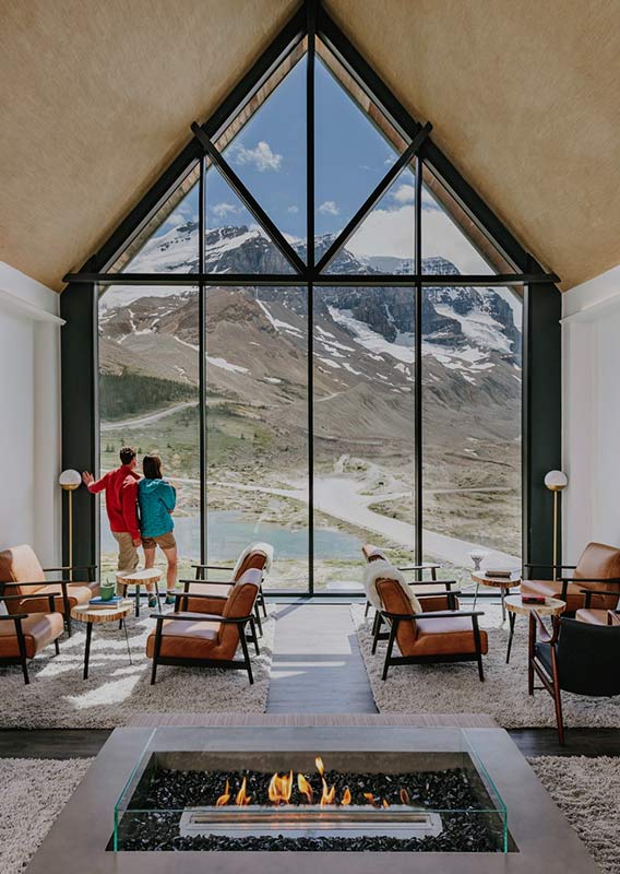 The view of the Athabasca Glacier from a high-ceiling lounge.