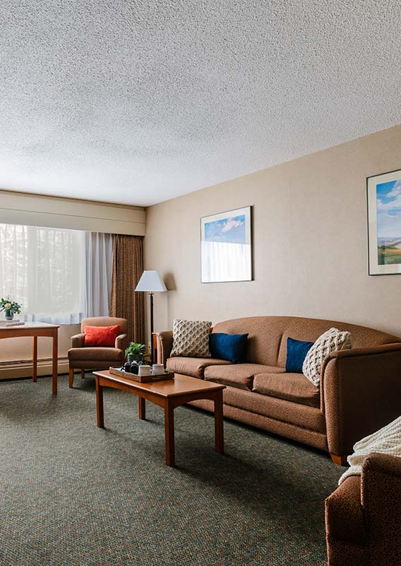 Couch, Chair and Coffee Table in a hotel room