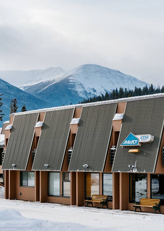 Snowy exterior of Marmot Lodge