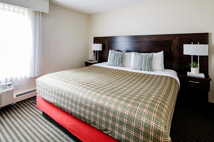 A king bed in a hotel room
