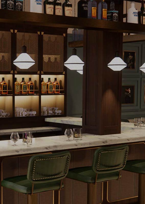 An empty bar with green chairs and white stone top.