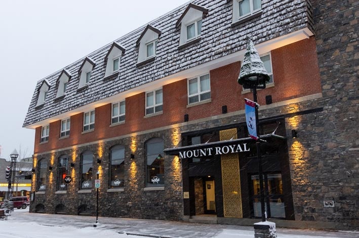 The Mount Royal Hotel and front sidewalk, covered in a dusting of snow