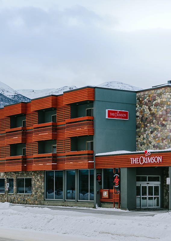 The Crimson hotel set with a mountain rising in the background.