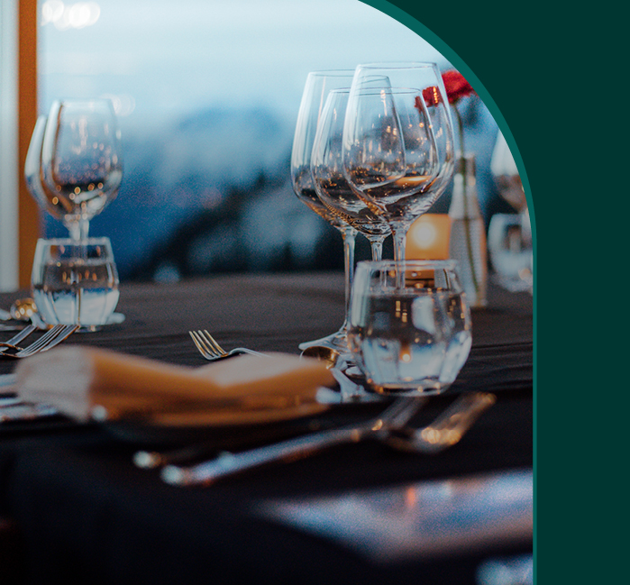 Close up image of a table's dinner setting with a text overlaid that says "Joy"