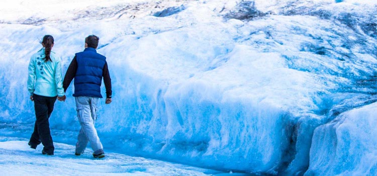 Couple walking on the Glacier