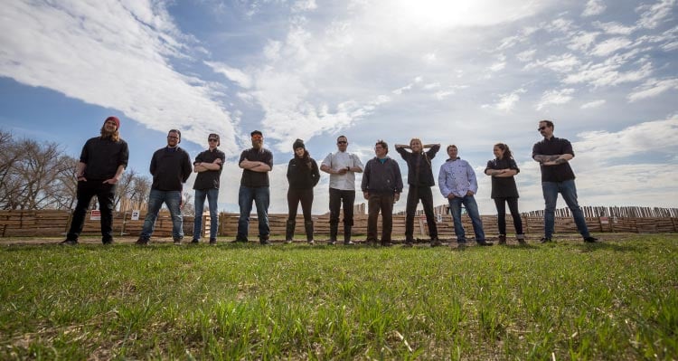 The Sky Bistro team stand together on a farm.