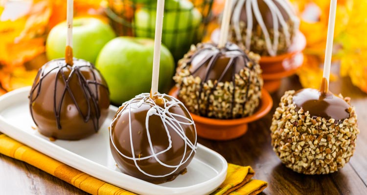 Chocolate and candy-covered apples.