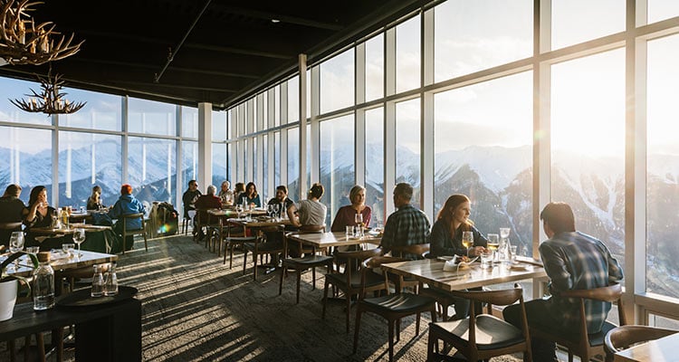 a wide view of the interior of a restaurant full of people