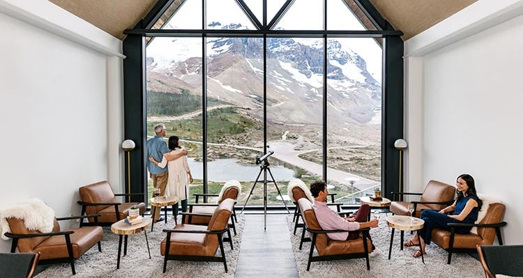 A view out of a lounge overlooking an alpine landscape.