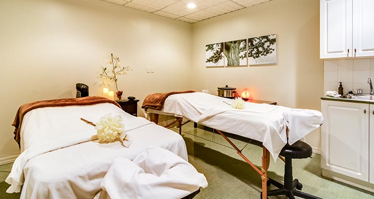 Two spa beds in a room.