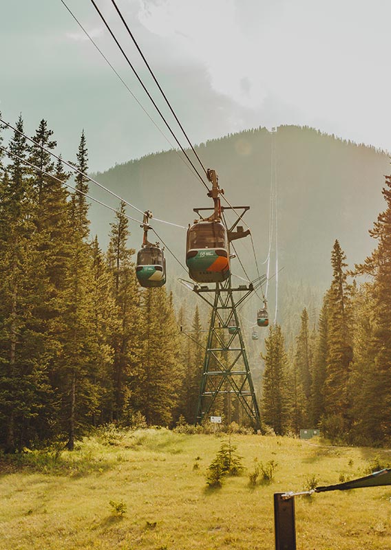 Gondola cabins going up the side of the mountain