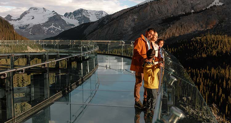 A family looks out at the Columbia Icefield Skywalk