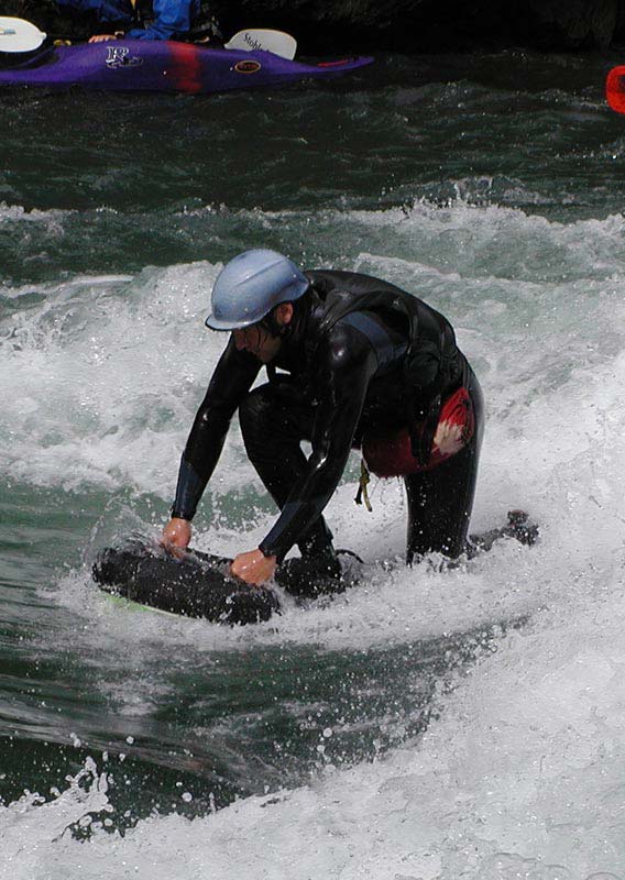 Getting up on a riverboard on the Kananaskis River