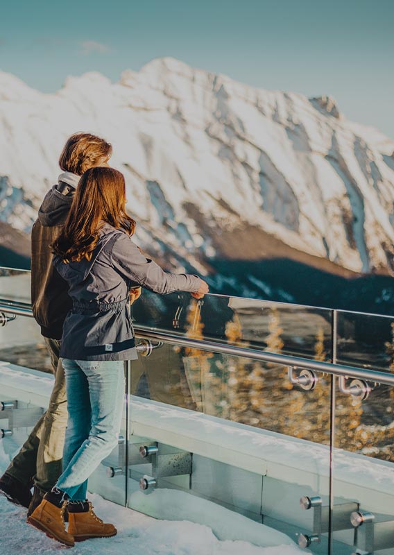 Couple looking at sunset at Banff gondola