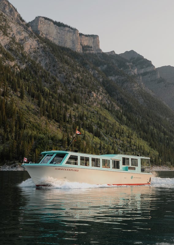 Boat cruising on Lake Minnewanka