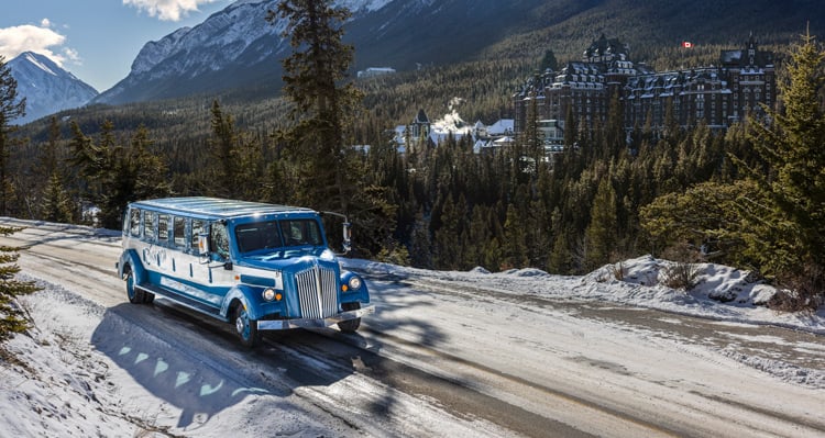 Open Top Tour driving past the Banff Springs Hotel in the winter
