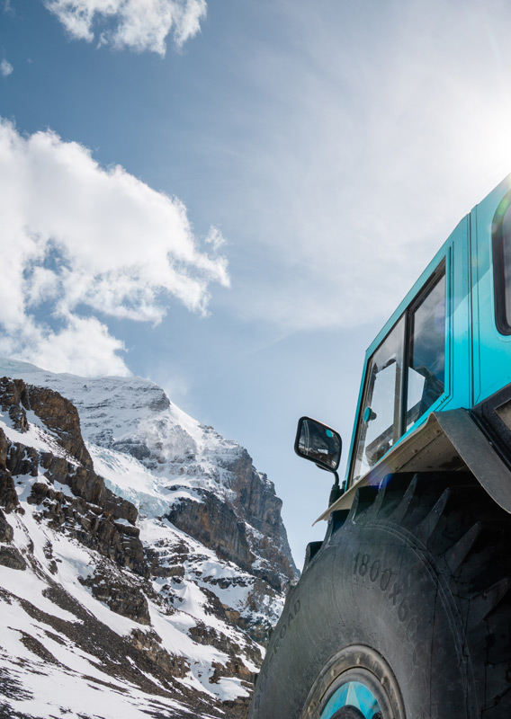 An upshot of the Ice Odyssey vehicle with a mountain in the background