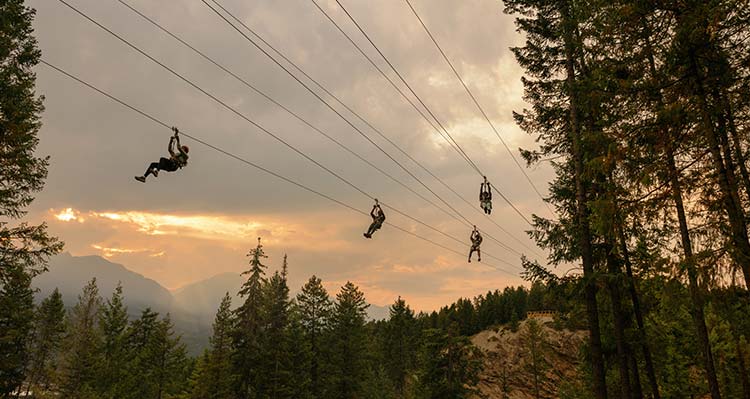 Zipliners at sunset.