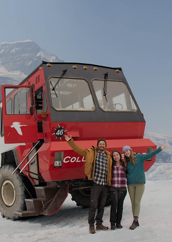 People pose in front of the Icewalks vehicle.