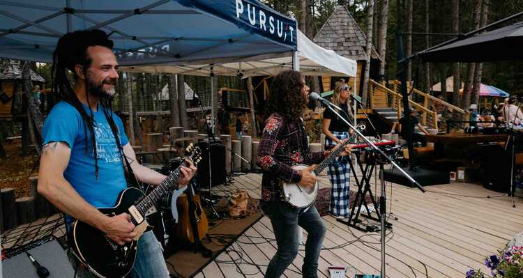 A band playing at an outdoor concert at Golden Skybridge