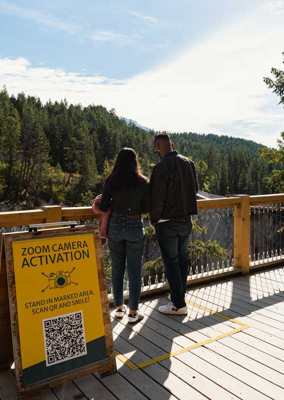 Two people taking photos of the view at GSB