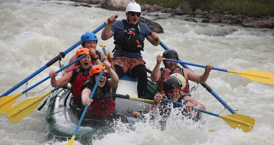 A group of people whitewater rafting in Jasper National Park.