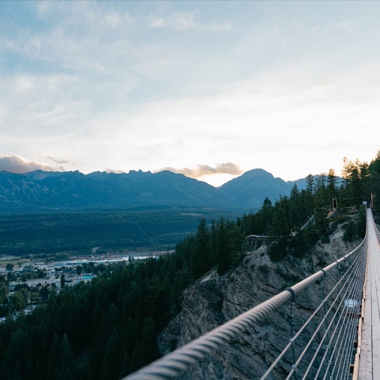 Golden Skybridge with a mountain view in the background