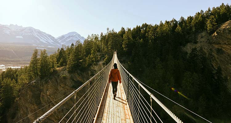 A woman walking away on the Skybridge.