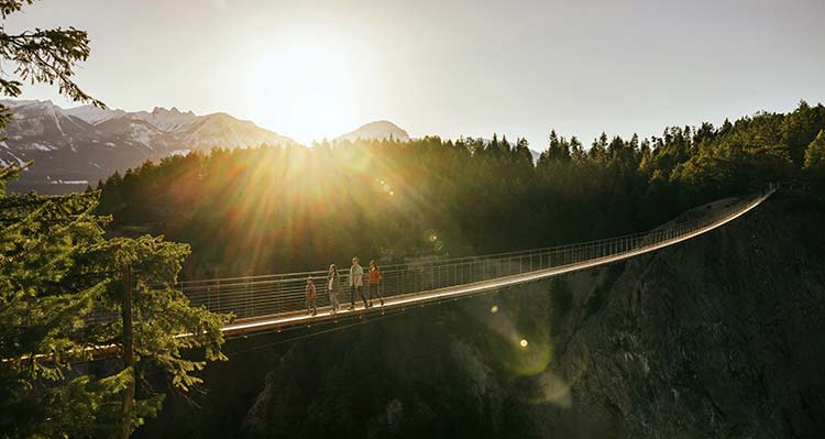 Golden Skybridge in summer, a sunburst in the top of the image.