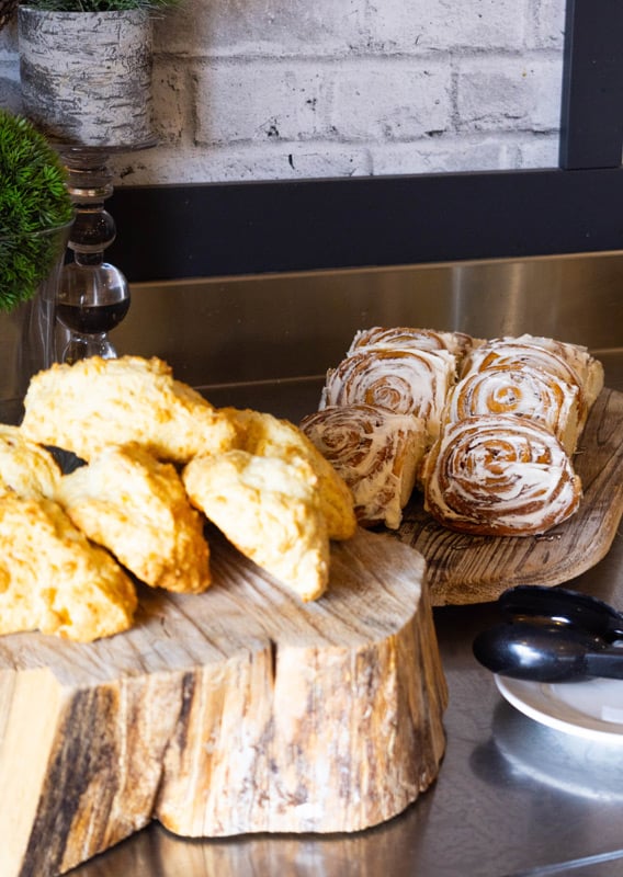 A Continental Breakfast with scones, cinnamon buns, and cereal