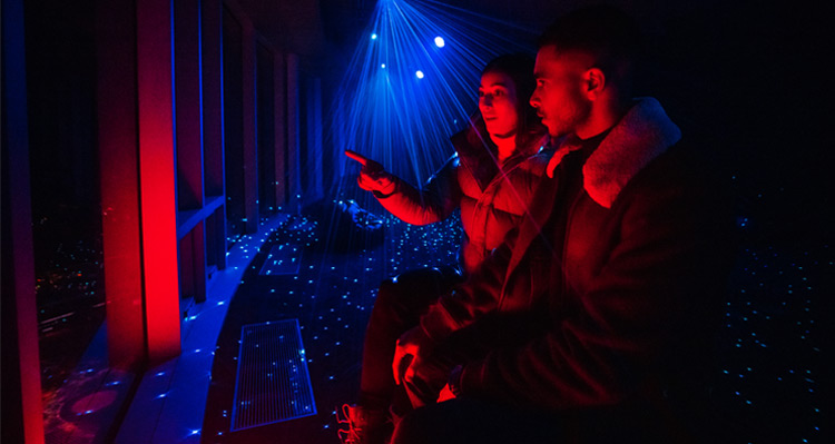 Couple exploring the Nightrise event at the Banff Gondola