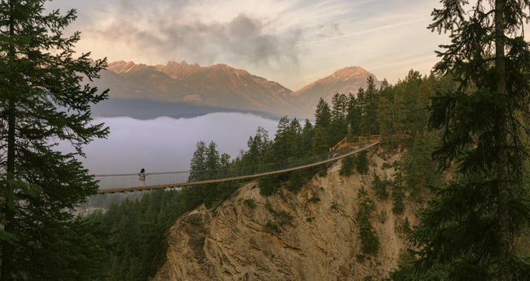 A person walking across the Golden Skybridge