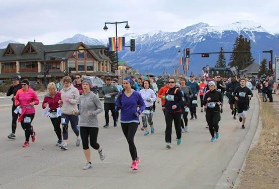 A group of runners on the road in Jasper.
