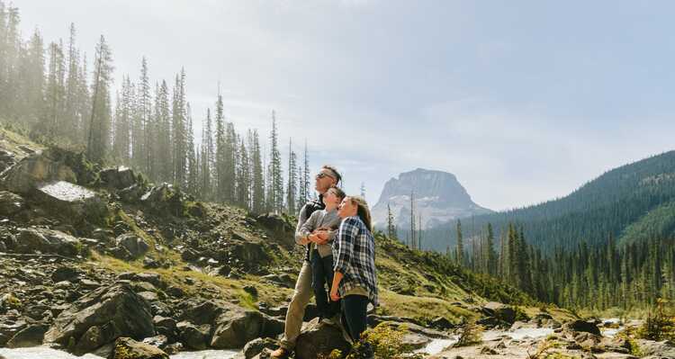Family on a hiking trail viewing the mountains