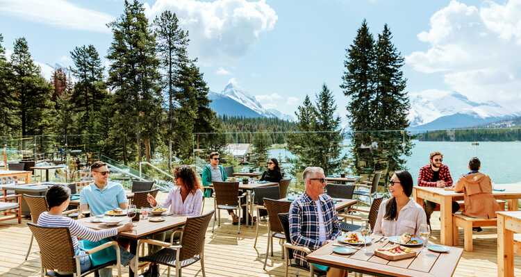 Guests Having Lunch by the Lakeside