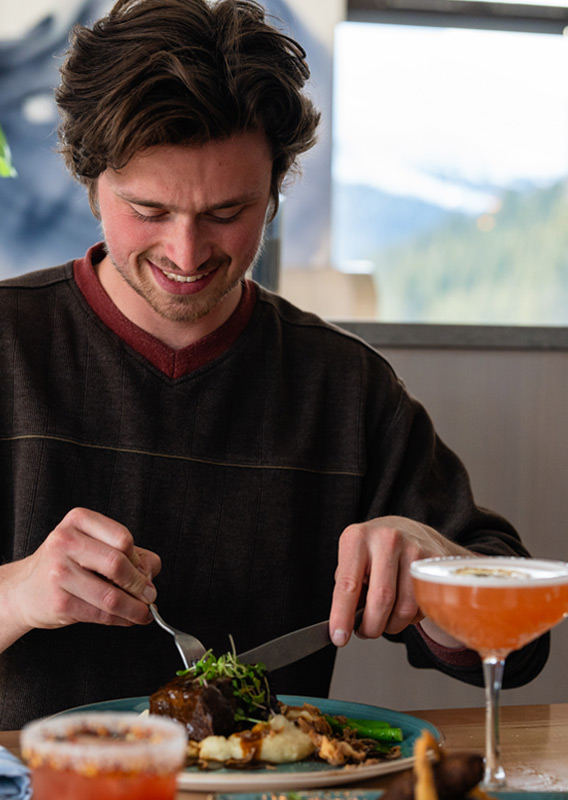 Guest enjoying an entree at Altitude restaurant