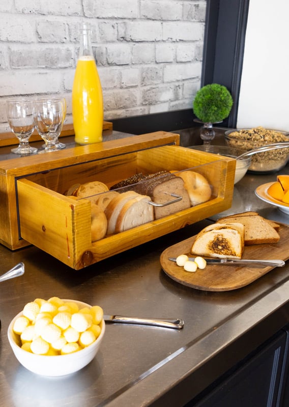 A Continental Breakfast with toast, jams, yogurt and granola