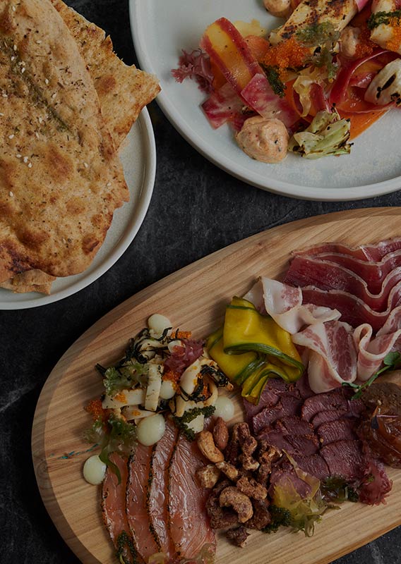 An above view of several sharing dishes at Aalto.