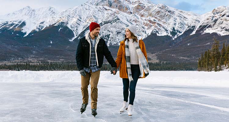 A couple skating on Pyramid Lake in the winter.