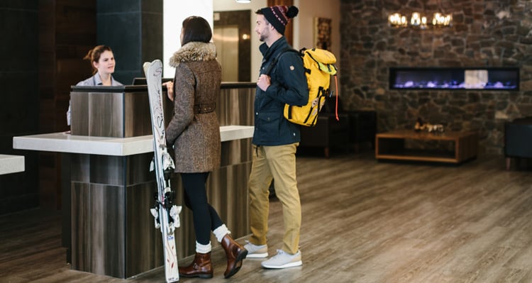 A couple checking in at the hotel lobby