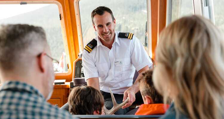 Cruise Guide talking with guests about Lake Minnewanka